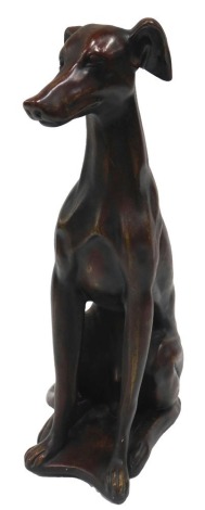 A modern cast figure of a seated Greyhound, 52cm high.