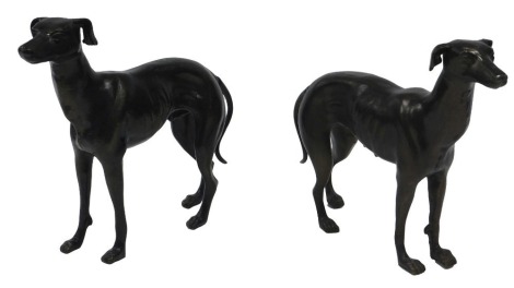 A pair of bronze effect cast iron Greyhound figures, 33cm long.