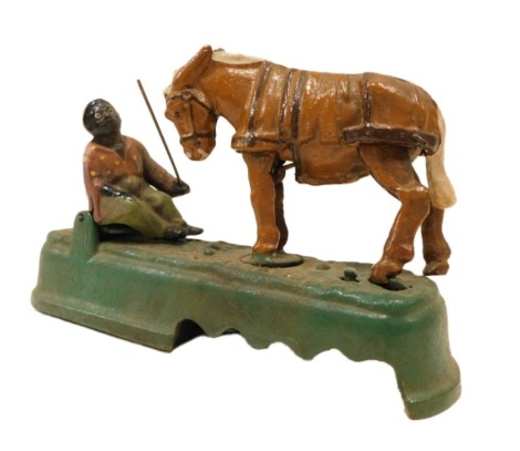 A painted cast iron money box, Always Did'Spise A Mule, 25cm wide.