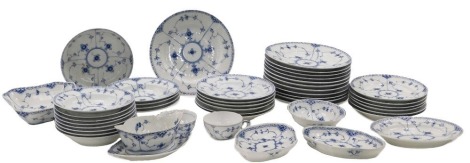 A Royal Copenhagen porcelain part dinner service, decorated in blue with flowers, etc., on a ribbed ground, printed marks in green to underside, pattern number 624, and with hand written marks.