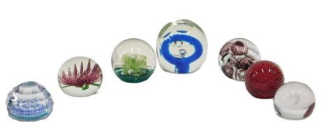 A collection of paperweights, various styles to include a Millefiore example, with faceted sides, etc. (7)