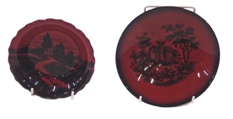 A Royal Doulton flambe dish, decorated with a landscape with a petalated border, printed mark to underside, and pattern number 8206E, 13cm diameter, and a flambe wood cut shallow plate or saucer, 16cm diameter.