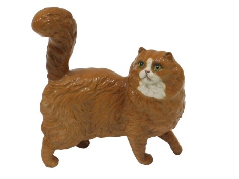 A Royal Doulton ginger cat, 12cm long.