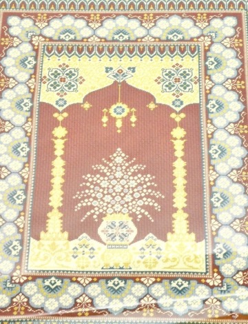 A woolwork embroidery of a Persian type carpet, bearing initials and dated 2000, 84cm high, 54cm wide overall.