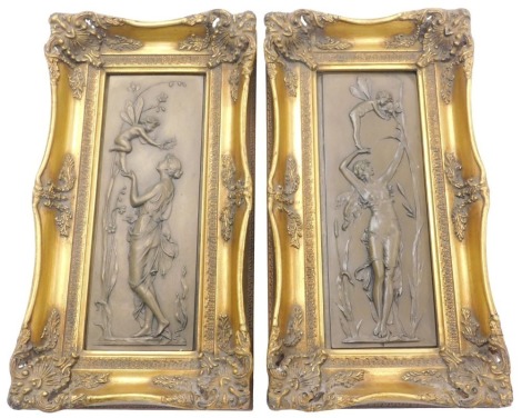 A pair of bronzed resin plaques, each cast in the form of a lady and a fairy or nymph in the art nouveau style, 31cm x 12cm.