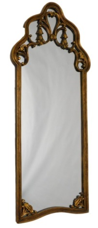 A gilt gesso wall mirror, the arched top embellished with scrolls and bell flowers, the base with pierced brackets, 140cm high, 58cm wide.