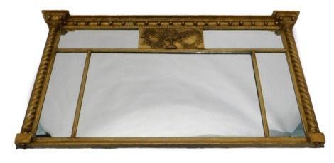 A 19thC gilt gesso overmantle mirror, with an arrangement of five plates, the frame decorated with spheres to the frieze above reeded pilasters, paw feet, 74cm high, 124cm wide.