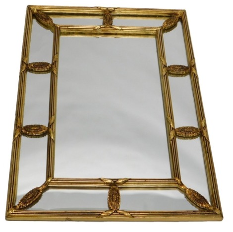 An Attewell gilt wall mirror, with central rectangular plate surrounded by further mirror plates, embellished with oval pattera, 80cm x 56cm.