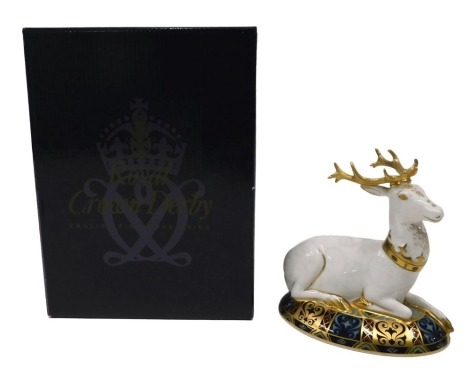 A Royal Crown Derby limited edition porcelain paperweight, The White Hart, number 1638/2000, gold button, boxed.