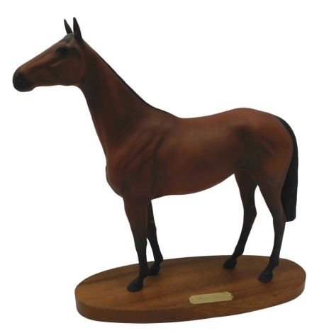 A Royal Doulton matte glazed figure Red Rum, on oval base, 35cm long.