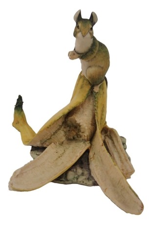 A Border Fine Arts figure of a mouse seated on a banana, printed marks to underside, 14cm high.