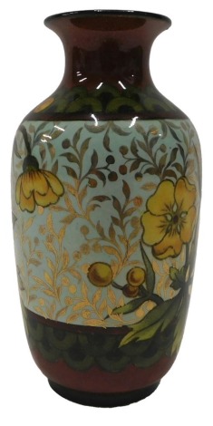 A 19thC Doulton Lambeth Studioware vase, decorated with buttercups on a pale blue ground picked out in gilt, circular printed marks to underside and various initials, etc., to include ES, possibly for Eliza Simmance, 12cm high.