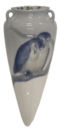 A Bing and Grondahl wall vase or hanging vase, decorated with a pair of owls and a single owl on a branch, 32cm high.