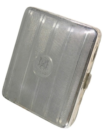 A George V silver cigarette case, with engine turned decoration, the lid engraved with monogram MA Xmas 1926, Birmingham 1926, 2.95oz.