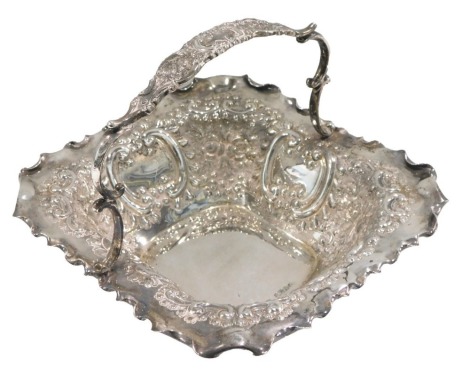 An Edward VII silver basket, embossed and engraved with scrolls, with loop handle, Sheffield 1901, 12.06oz, 20cm wide.