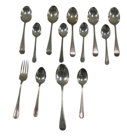 A quantity of silver teaspoons and a cake fork, various dates and patterns, 6.59oz.