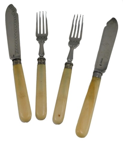 Two Victorian fish knives and two forks, from a service, each with a bone handle and silver blade, Sheffield 1886.