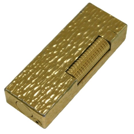 A Dunhill gold plated lighter, with textured finish, stamped Made in Switzerland.