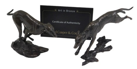 A Michael Simpson bronze effect figure, titled The Running Whippet, limited edition number 33/150, 12cm long, with certificate, and a similar dog. (2)