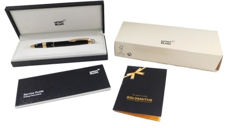 A Mont Blanc Starwalker red gold plated resin ballpoint pen, boxed and with paperwork.