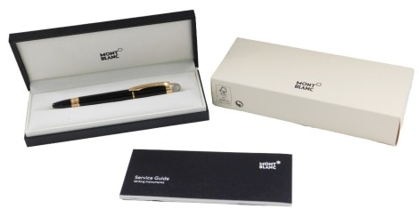 A Mont Blanc Starwalker red gold plated resin fountain pen, boxed and with paperwork.