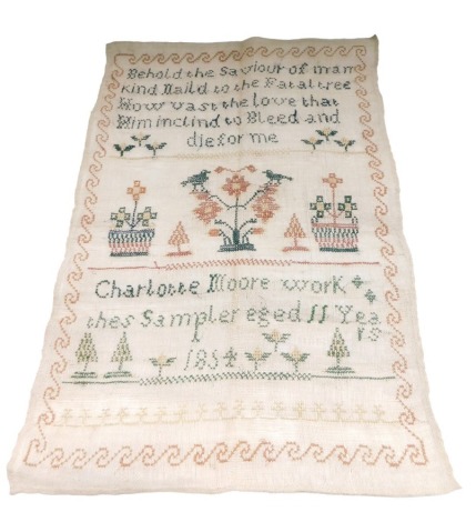 An embroidered sampler by a Charlotte Moor, aged 11 years, 1854, unframed, 40cm x 28cm.