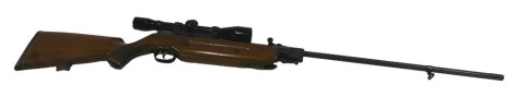 A German air rifle, with indistinct maker's stamp, walnut stock, and blackened metal sight, 121cm long.