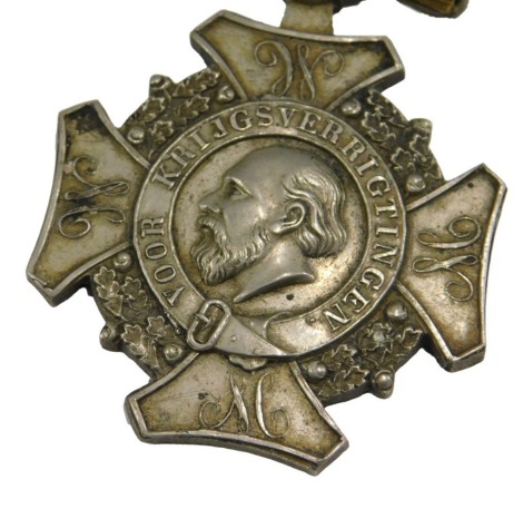 A Netherlands Expeditions Cross medal, with green and gold ribbon.