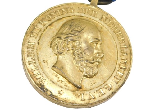 An Atjeh or Kraton medal, dated 1874, with blue ribbon.