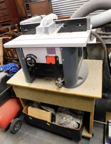 A router table, DK-2080, with various accessories.