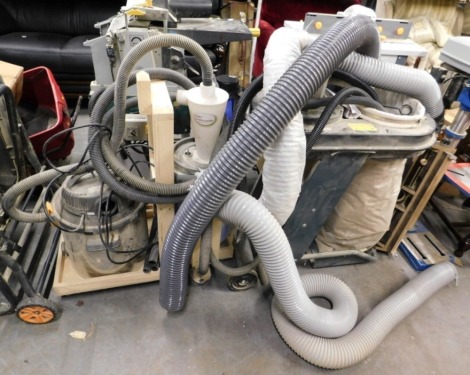 A Titan wet-dry vac vacuum, TTB340VAC, together with a dust commander, and another.