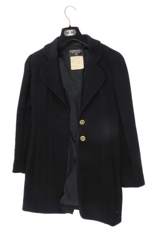 A 1980s Chanel boutique black long line jacket, with two CC buttons, size 38.