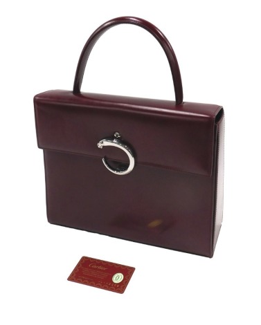 A Cartier burgundy leather panthere handbag, 22cm high.