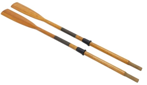 A pair of rowing oars with copper and rubber mounts, 180cm long.