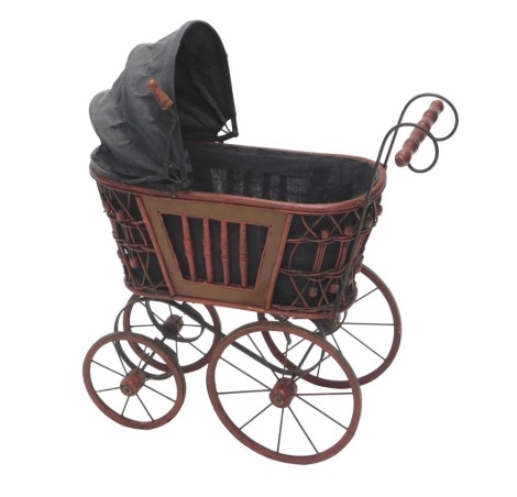 A wooden and wicker child's pram, painted red, 64cm high.