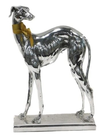 A painted silver resin model of a greyhound, on rectangular base, 64cm high.