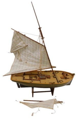 A pond yacht, with mast, on stand, 71cm wide.