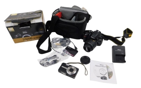 A Nikon D3200 DSLR camera, together with an 18x55mm lens, with a canvas camera case, boxed.