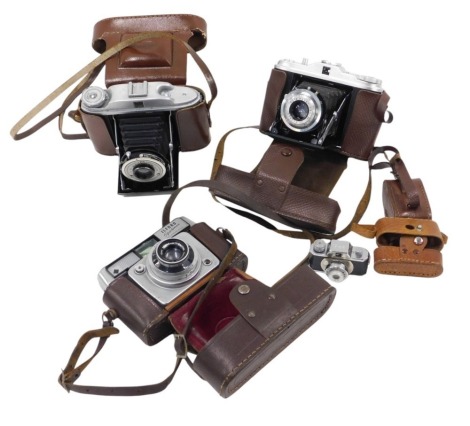 A group of cameras, to include an Ilford Sportsman, Agfa Isolette, miniature kit camera, etc., each in a leather case.