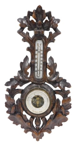 An early 20thC Black Forest barometer, the dial stamped Otto Engelke, Momel, in elaborately carved acorn case, 46cm high.