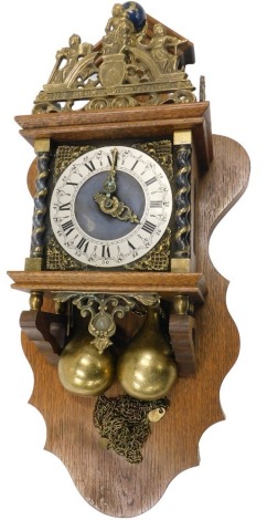 A Dutch wall clock, cast with figures, in oak case, 60cm high. Buyer Note: VAT payable on the hammer price of this lot