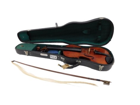 A Copie de Antonio Stradivari Saxon two piece split cane back violin, and bow, with mother of pearl capped end, 66cm long, in hard shell carry case. (AF)