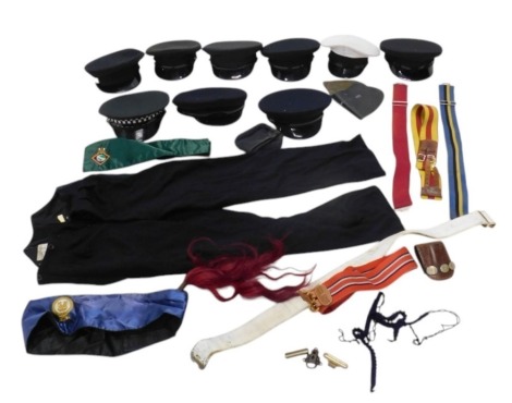 A quantity of military and police uniform, various types to include belts, caps, etc.