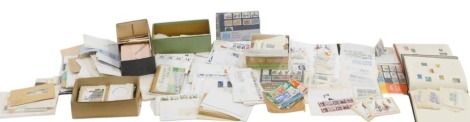 A quantity of first day covers, loose stamps, etc., various shoe boxes, two albums.