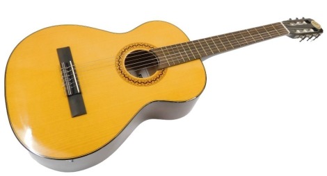 A Kapok Chinese accoustic guitar, model KC 265, 96cm high, boxed.