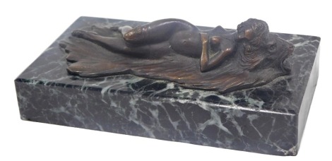 A bronze nude reclining figure of a lady on a blanket, indistinct initials, on marble plinth, 12cm wide.