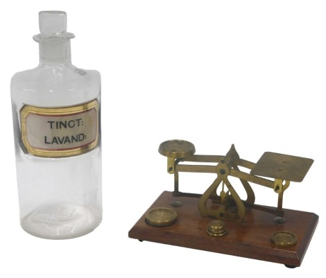 A set of brass and mahogany letter scales, 17cm wide, and a chemist bottle (AF).