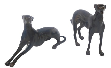 Two similar of bronze effect cast iron Greyhounds, 20cm and 14cm long.