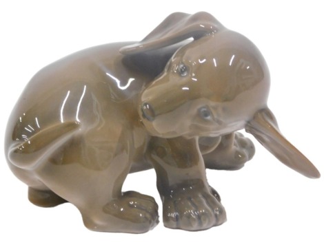 A Royal Copenhagen porcelain model of a Dachshund, number 1407, 11cm wide.