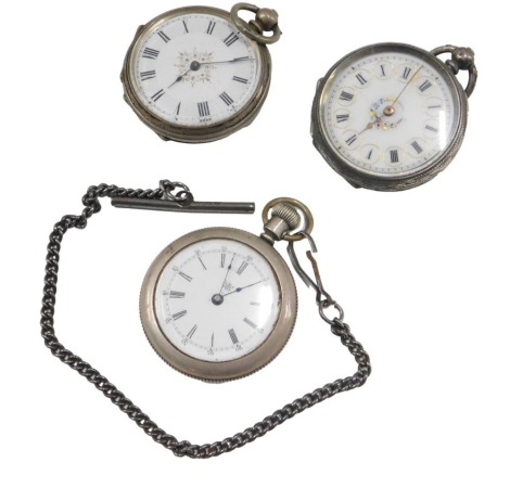 A white metal cased Continental fob watch, and two others.